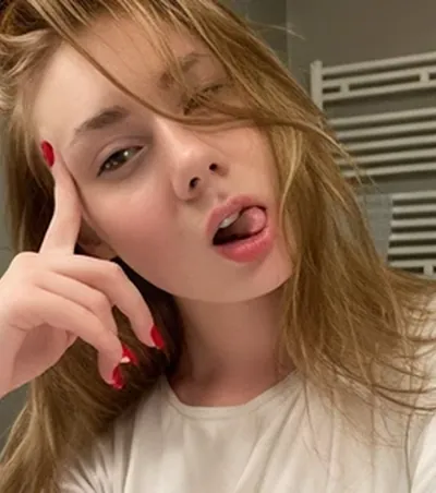 Blonde OnlyMonster creator pulling a playful face